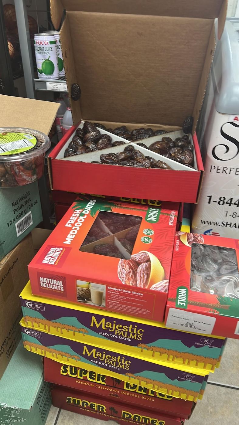 Boxes of fresh Medjool dates stacked in the store