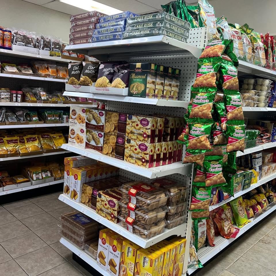 Shelves of biscuits, cake rusk, dal muth and crackers